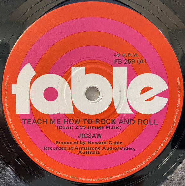 Jigsaw (17) : Teach Me How To Rock And Roll (7", Single)