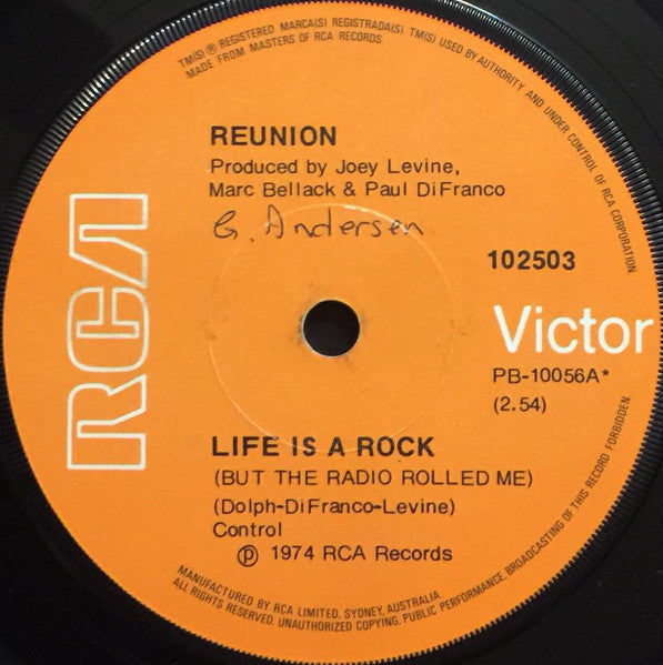 Reunion (3) : Life Is A Rock (But The Radio Rolled Me) (7", Single)