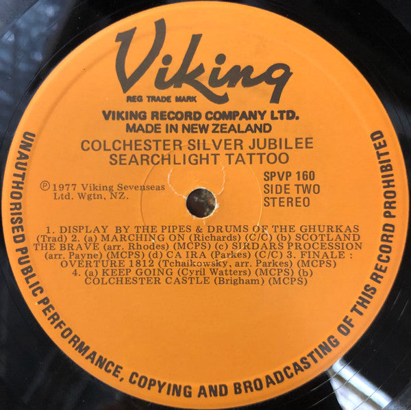 The Massed Bands And Corps Of Drums Of The Queen's Division, The Mounted State Trumpeters And Drum Horses, The Massed Tattoo Bands, Corps Of Drums And Pipers, The Pipes And Drums Of The Gurkhas Rifles* : Colchester Silver Jubilee Searchlight Tattoo (LP)