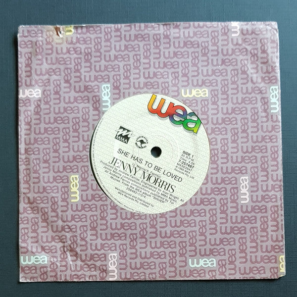Jenny Morris : She Has To Be Loved (7", Single)